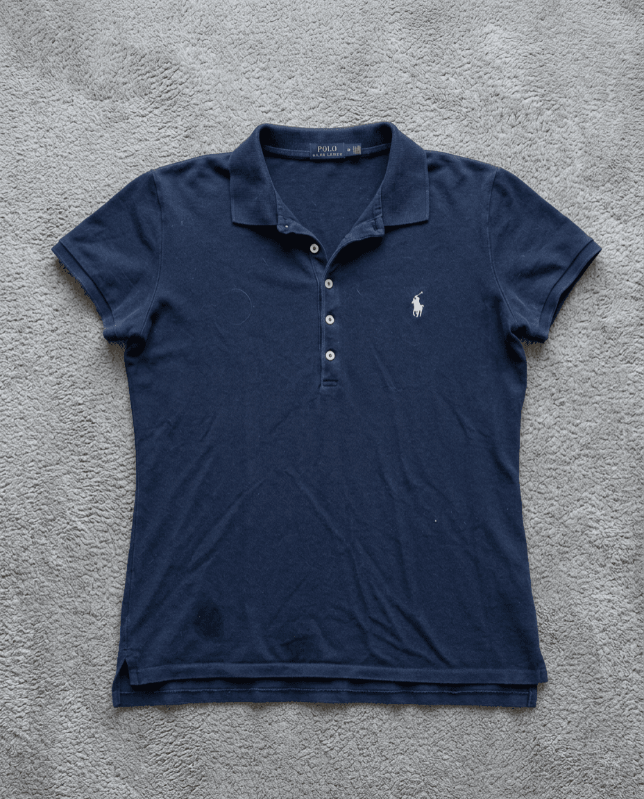 Polo Ralph Lauren bleu marine femme sur tapis gris